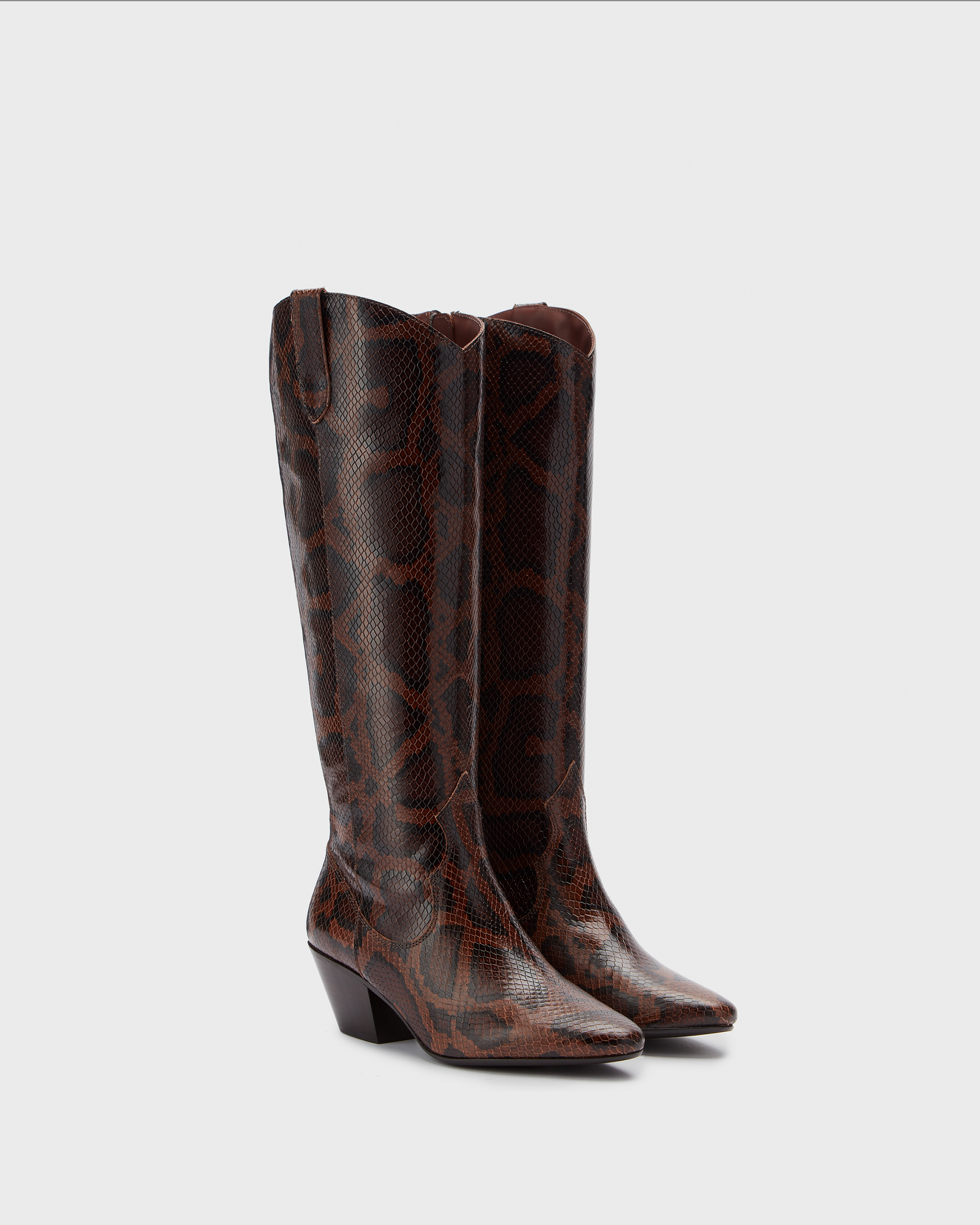 Knee high western style cowboy snake heeled boot